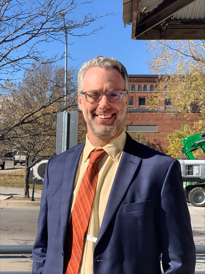 Nebraska State Director smiling towards the camera.