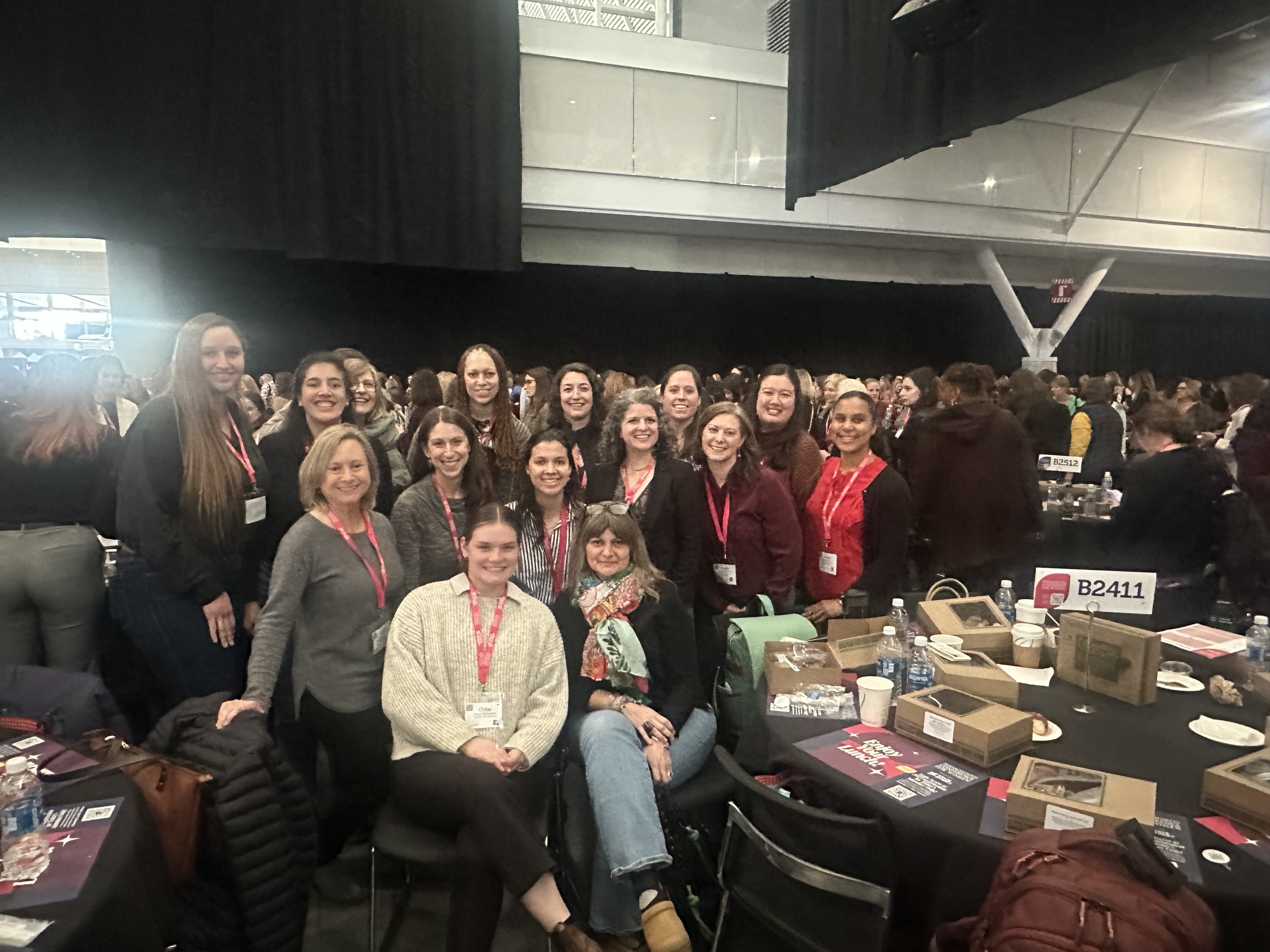 A group of TNC staff pose for a group photo in the Boston Convention Center for the Massachusetts Conference for Women 2024.