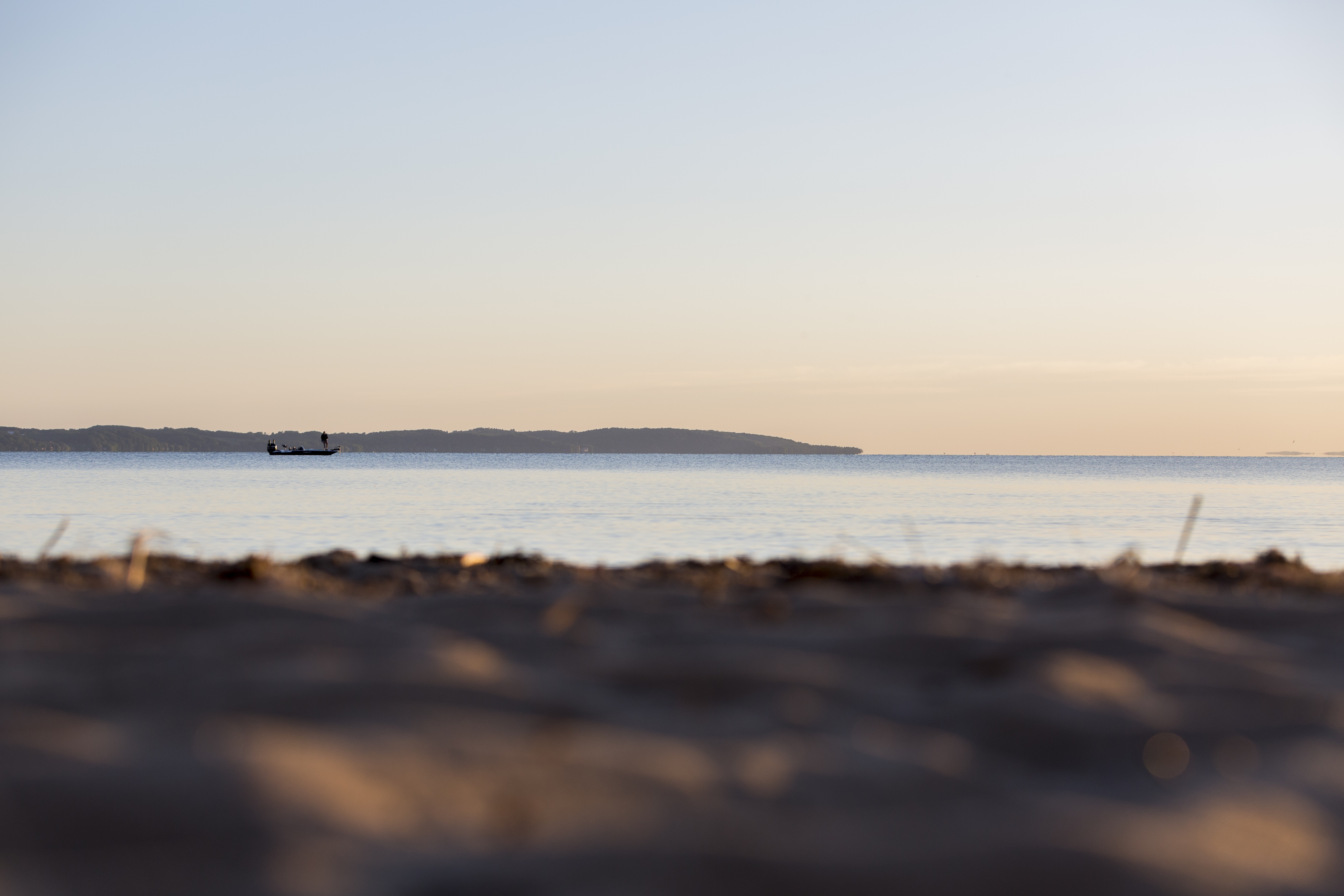 A fishing boat out in Grand Traverse Bay, part of the Elk Rapids Chain of Lakes watershed.