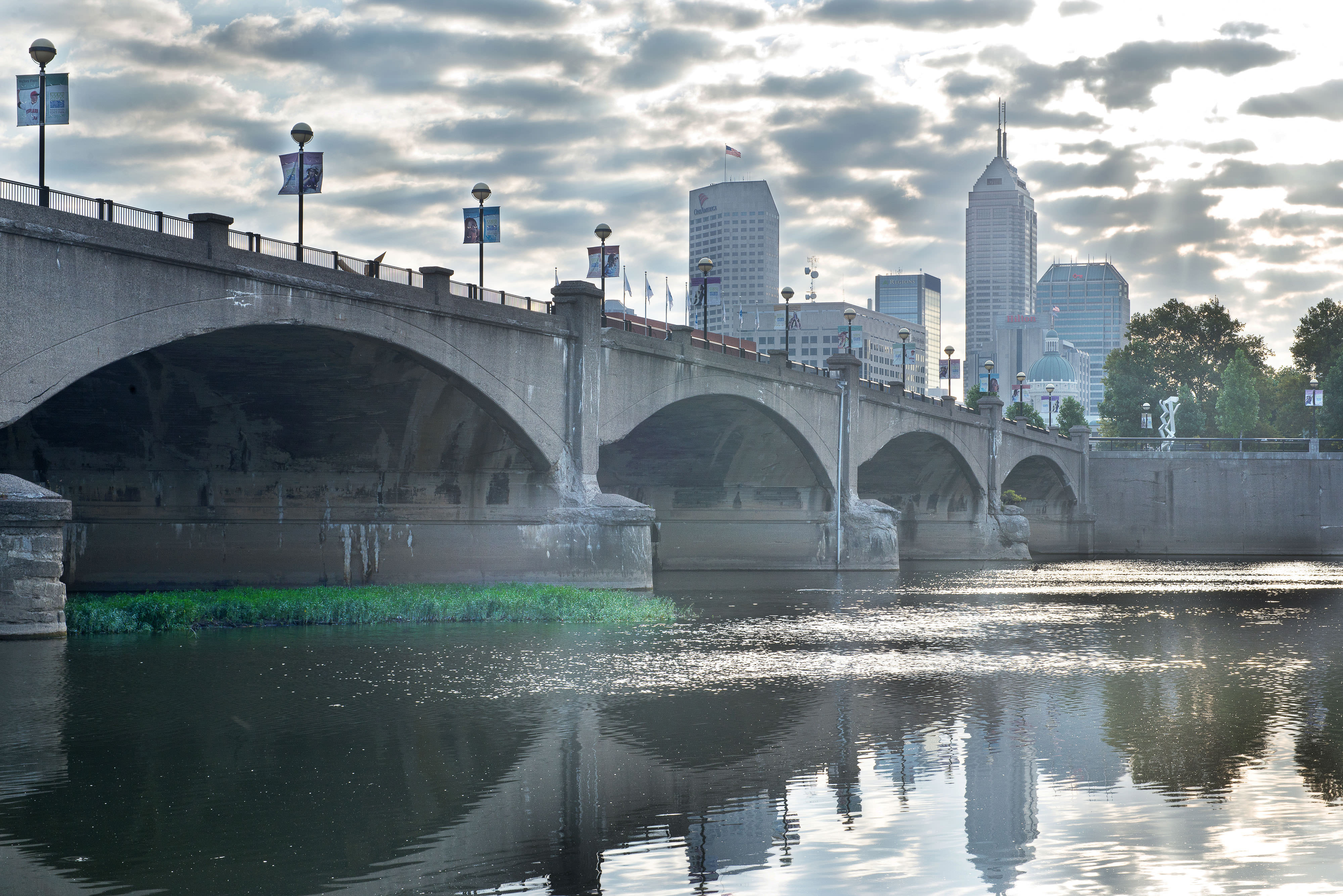 River runs under a bridge. 